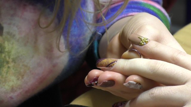 Girl doing beautiful nail design