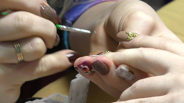 Girl doing beautiful nail design