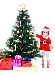 girl decorates the Christmas tree