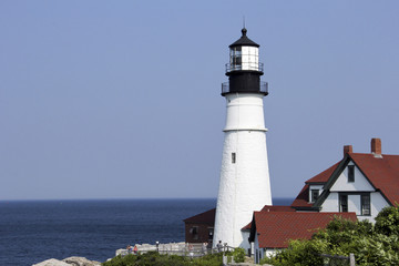 Fototapeta na wymiar Lighthouse on a Rocky Point