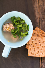 Soup with meatballs and parsley