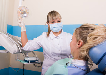 dentist examines the patient's mouth. the patient is ready for treatment teeth