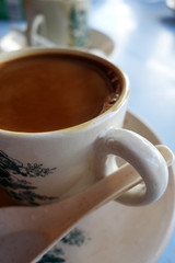 Traditional oriental Chinese coffee in vintage mug and saucer