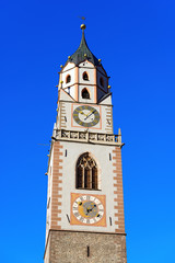 Bell Tower of the Cathedral of Merano - Italy / Detail of the bell tower of the Cathedral of St. Nicholas (1302-1465) in Merano, Bolzano, Trentino Alto Adige, Italy