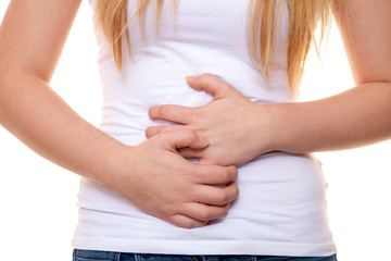 Attractive young woman stomachache. All on white background.