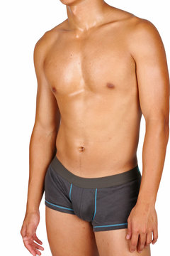 hunky asian in boxer trunks over white background