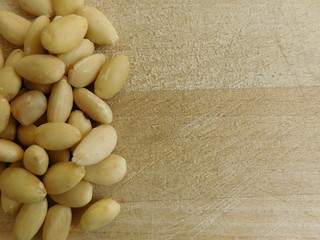 almonds to eat on wooden base
