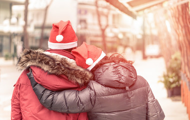 Young Couple hugging eachothers for Christmas time - Love and holidays concept - Vintage...