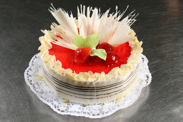 sweet cake with strawberry on grey background