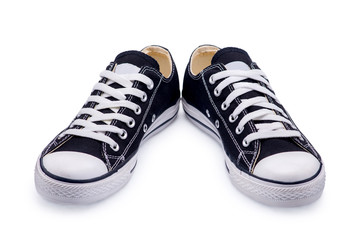 A pair of black gumshoes with shoelace