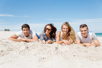 Fototapeta premium Company of young people on the beach