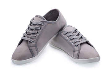 A pair of gray gumshoes with shoelace