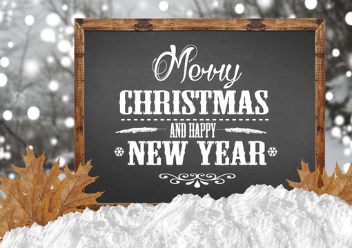 Merry Christmas and Happy New Year on blank blackboard with blur