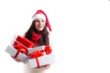 Cute smiling woman in Santa hat holding a red and white presents.