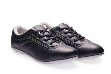 A pair of black sports shoes with shoelace