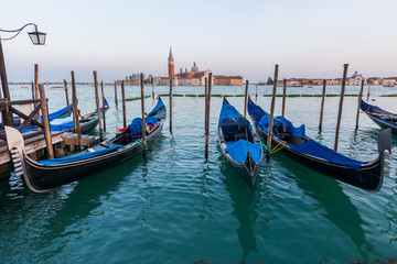 Fototapeta na wymiar Gondolas on Grand Canal in Venice, Italy