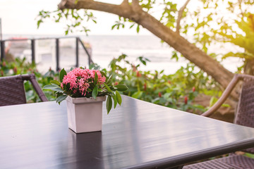 Flowers bouquet on wooden table with soft light