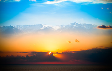 Beautiful sunset over mediterranean sea. Collage. Toned