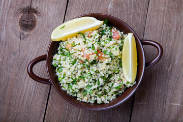 Turkish traditional meal - Taboulé Salad on a wooden table made