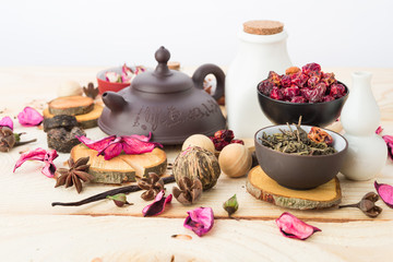 dry tea leaves cinnamon and on wooden background