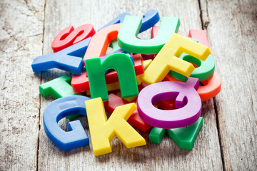 Fototapeta premium Pile of colorful plastic letters