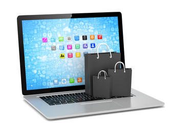 laptop and  shopping pags on white background