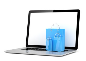 laptop and  shopping pags on white background