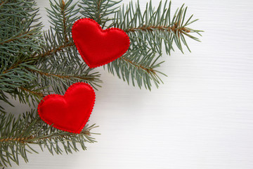 Two hearts with fir branch