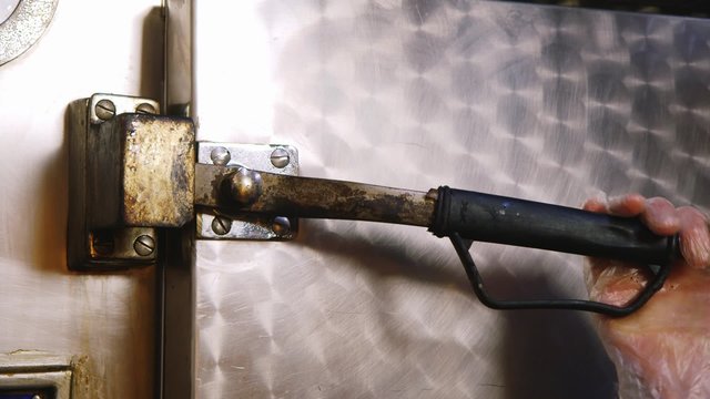 Open the valve on the large metal door refrigerator