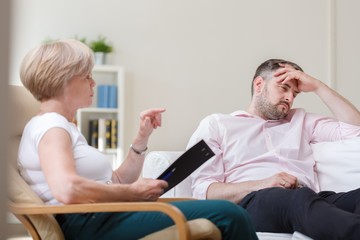 Depressed man with therapist