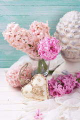 Pink  hyacinths,  decorative heart and  terracotta cone