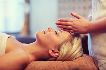 Fototapeta na wymiar close up of woman having face massage in spa