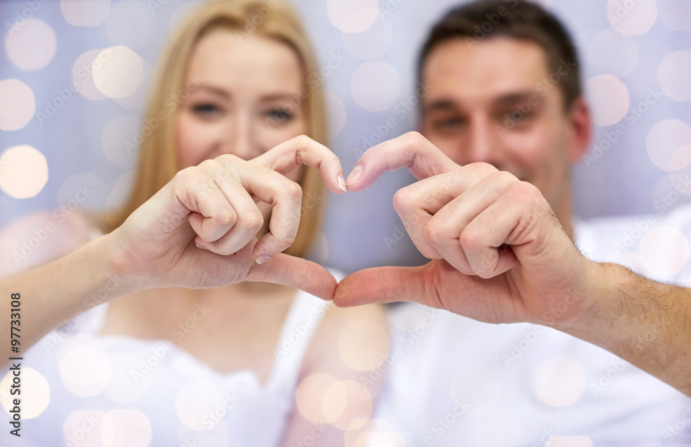 Sticker close up of couple showing heart with hands