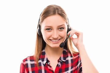 A portrait of pretty young worker in call centre