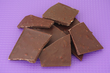 Broken dark chocolate with nuts