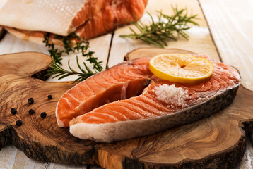 Salmon steak on wooden board