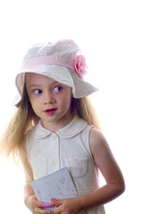 Young blonde little girl with white hat