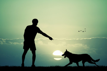 man and dog at sunset
