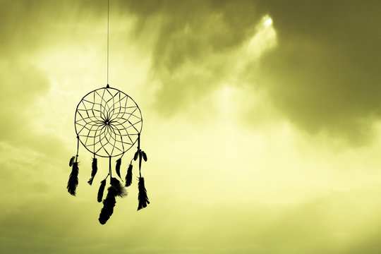 dreamcatcher silhouette at sunset
