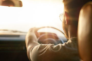 Young man driving his car © Jacob Lund