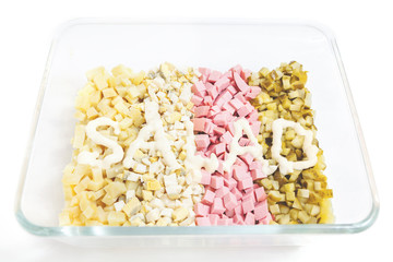 Cut ingredients for salad and inscription mayonnaise