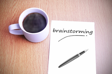 Coffee on the table with note writing brainstorming