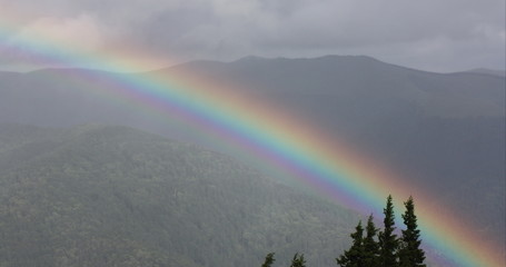 Rainbow over mountains - 97746111