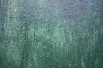 wall with a faded green paint color