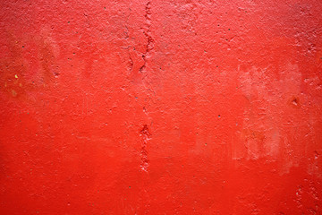 wall with a faded red  paint color