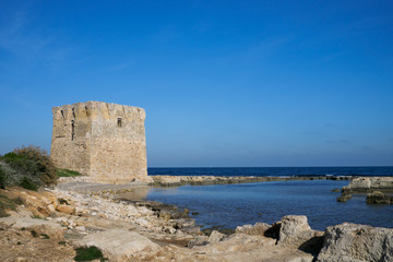 Coast of Polignano a Mare with an ancient defense tower - Apulia, Italy