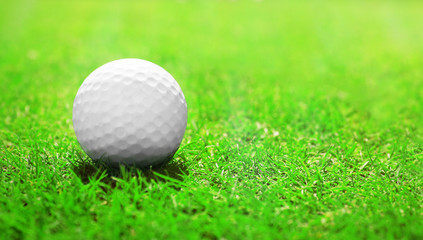 Golf ball on green golf course