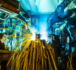 Welding robots movement in a car factory