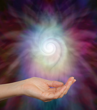 Spiral Energy Field -  Female hand outstretched palm up gently cupping a beautiful ethereal spiraling energy formation 