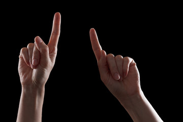 Caucasian female hand, pointing to something with an index finger